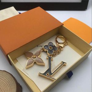 2024 Small flower key chains for men and women, stylish keychains with letter animal patterns, high quality vintage pendant buckles