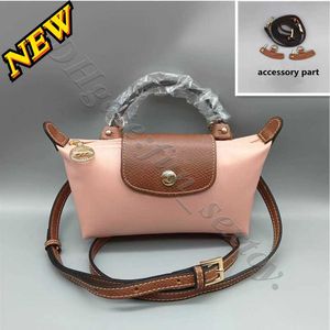 Designer bags for women 2024 Difference Wholesale Original Perforated Pink Color Toiletry Version of Strap nylon Mini Slight Dumpling Small Choose Shoulder UD3J