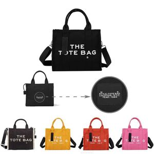 Tasarımcı Tote Çanta Mac the Womens el çantası omuz lüks yüksek kaliteli crossbody moda tuval çanta siyah büyük 2y4s