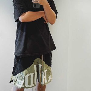 Rhude stworzył niszowe modne hawajskie sportowe szorty męskie z patchworkowymi nastolatkami i damskimi spodniami hip-hopowymi
