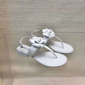 Guangzhou 2024 Summer Small Fragrant Style Genuine Leather Flat Bottom One Line Buckle with Camellia Blossom Clip Toe Outward Wear Beach Roman Sandals