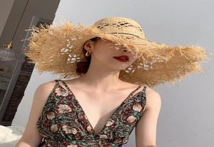 Chapéus de aba larga Mulheres Summer Summer Natural Raffia Straw Hat Sun Big Fringe Fringe Hollow Sol -Selfreen Bucket Cap Bohemia Beach Fashion3944154