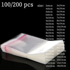 Çantalar 100200 PCS Şeffaf Ziplock Opp Plastik Torba Takı Hediye Çantası Yapışmaz Kurabiye Şeker Çantası Selofan Çanta Mühür Cep