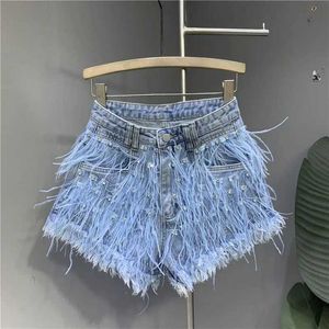 Frauenshorts Sommer neue Mode -Denim Shorts Frauen Personalisierte Quasten Diamond Wash Hellblau Kurzjeans Mode sexy Feather heiße Hosen Y240420