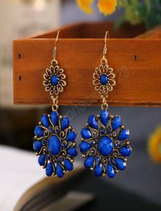 Retro Blue Flower Stone Dingle Earring för kvinnor Solrosform Guldfärglegering Dingling örhängen Jhumka Indian Jewelry6053855