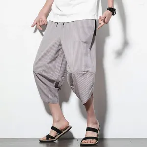 Calça de cenoura listrada de cenoura masculina cortada com harém de estampa vertical de cintura elástica de cordão para streetwear