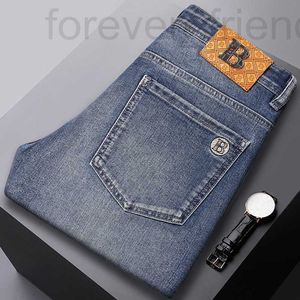 Herren Jeans Designer 2024 High -End -Marke Frühling/Sommer Neue Freizeit Schlanker Fit Small Foot Sticked Blue Elastic Dünnstil 44S3