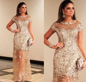 Luxury Sparkly Gold Sequined Prom Dresses Sexig besättning täckta ärmar Se genom Champagne Formell kväll Celebrity Party Dress Duba7493908