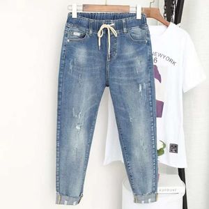 Kvinnors jeans vår sommar jeans kvinnors stretch fett syster niopunkt var tunna höga midjbyxor plus storlek 5xl 230427