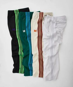 Bolsos laterais da cintura elástica Aunchas Homens Mulheres 1 1 Versão cor listrada bordando bordado de borboleta calças Awge Troushers 240420