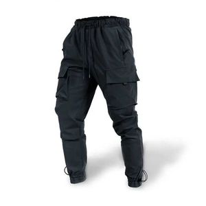 Calças masculinas outono e inverno Novo masculino casual solto de tamanho grande calça de tecido com vários bolsos para calças esportivas Y240422