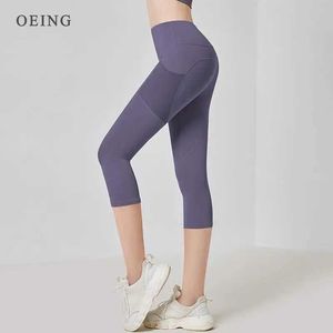 Kvinnors shorts Kvinnors sportben Hög midja Sur Yoga Pants Elastic Mesh Pockets Running Caps Gym Crop Ben Slim Fitness Leggings Y240422