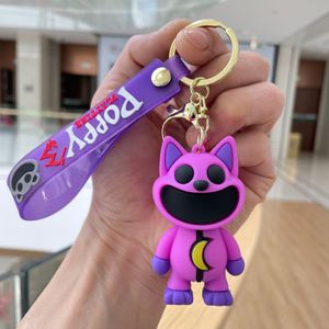 Keychains smiling critters Rubber Keychain Cute Bottle Key Chains Ornament Car Bag Pendant Keyring