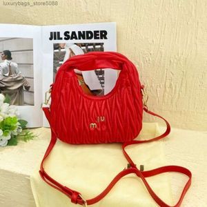 Luxushandtasche Designerinnen Frauenmarke Tasche Neue Damen Mode vielseitig Mädchen Süßes Stil Plisöses weiche Hand -Unterarm Eins Schulter schräge Kreuz gebogen und Pfeiltasche