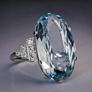 Zespoły Huitan Femil Light Sky Blue Wedding Ring Band Oval Stone Engage Party Women Luksusowe biżuterię Shine Cz Stone Best Gift