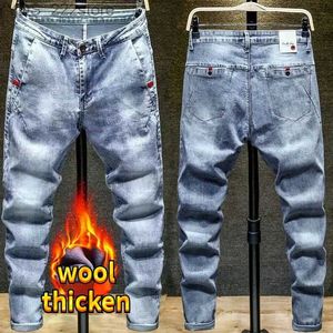 Kvinnors jeans höst och vinterborstad ull tjock plysch denim smal fit elastiska jeans män denim arbetskläder varor denim lyx tält bomullsbyxor yq240423