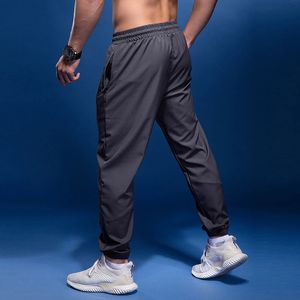 Pantaloni sportivi Bintuoshi uomini che corrono con tasche con cerniera calcio di calcio pantaloni sportivi joggings fitnesspants 240412