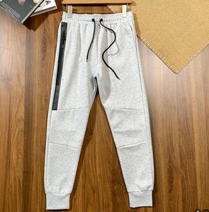 Space Cotton Tech Sportshosen Männer Frühling und Herbst Neuer Druck Gummi Lange Reißverschluss -Jogginghosen Freizeithosen