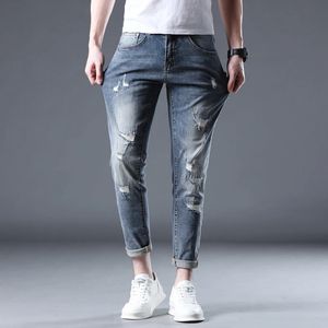 Jeans strappati uomini magri in forma hip hop blu scuro pantaloni in denim allunga la caviglia di strega per uomo cowboy estivo 240417