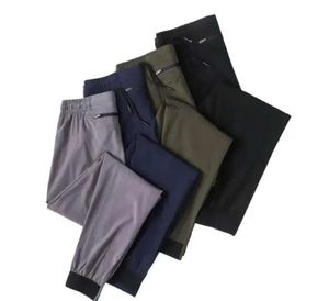 Ll calças de corredor masculinas longas esportes de ioga de ioga rápida ginástica seca bolsões de ginástica calça calça calça mensual elástico elástico designer de fitness roupas de moda 435365