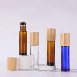 Förvaringsflaskor tomma 10 ml bärnsten klar blå massage pinne parfym eterisk oljeglasrulle på kulflaska med bambuskydd