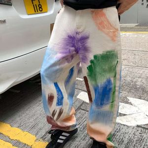 Kolorowe dżinsy graffiti krawat dla mężczyzn i kobiet, letnia High Street modna luźna ulica hip-hopowe szerokie nogi długie spodnie