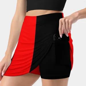 Scherma della gonna da donna con minigonna rossa mezza nera con tasca
