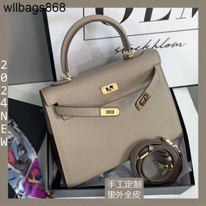 Totes Women Bolsa Ky 2024 Novo Popular Summer Cowide Chave High End Saco de couro genuíno Segunda geração Mini Crossbody Handheld Small Bag Girl