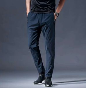 Ll homens jogadores calças longas esportes de ioga roupa rápida ginástica seca ginástica zíper bolsões de moletom calça calça mensual elástico elástico designer de fitness roupas de moda 9