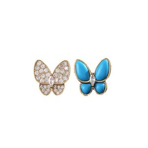 Wysoka wersja modna wysokiej klasy wszechstronna temperament Van Butterfly Kolczyki kobiet Asymetryczna niebieska emalia pełna biżuteria diamentowa