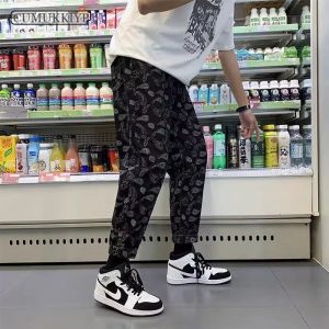 Pants Cumukkiyp Men's Casual Baggy Pants Cashew Flower Mönster Summer Trendy Personlig avsmalnande ben High Street Hiphop Jogging Pants