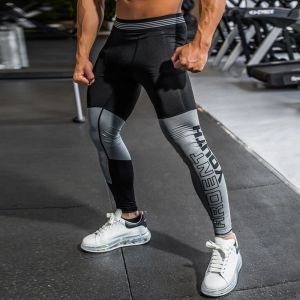 Calças novas calças de corrida de compressão HOMBRE SPORT LEGGINGS PARA MEN SPORT LEGNGGING Splicing Fabric Craft Treinamento de fitness calças Men Slim