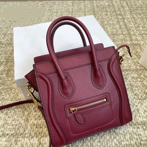 Bagage nano kalvskinn kaviar designer axel väska crossbody väska leende ansikte tygväska triomfes dragkedja stor kapacitet shopping klassiska hobo handväskor burgundy