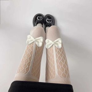 セクシーな靴下パンスト日本のパーティーフィッシュネットブラックタイツボウノットjkメッシュロリータホールビッグサイズセクシーな薄手の女の子