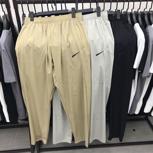 Sommarvarumärkesdesigner Snabbtorkning Pants Gym Mäns andas sportkläder utomhus träning fitness byxor mångsidiga långa byxor