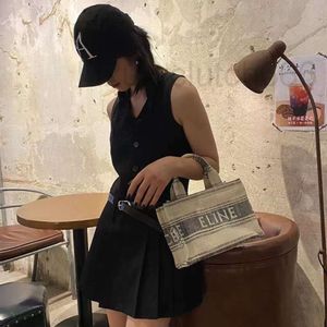 Lady Bags Cel El Çantası Tasarımcı Sepet Alışveriş Cel Tatil Fotoğraf Çanta Sebzesi Dokuma Zafer Kemeri Dokuma Logo Çizgili Tote Çanta 2024 YENİ JQUARD KOAM H V8G