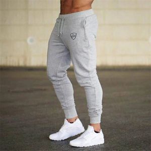 Byxor nya jogging byxor män fitness joggar som kör byxor män tränar sport leggings sportkläder svettbyxor kroppsbyggande tights