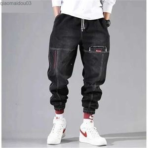 Men's Jeans Korean fashion ankle strap denim mens jeans black gray cargo mens elastic pocket harem pants street clothing hip-hop jeansL2404