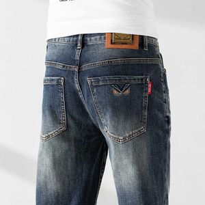 Jeans europeiska mens vår och sommarvatten tvättade smala passade små raka rör high end fötter elastiska mångsidiga