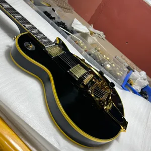 Chinese electric guitar mahogany body black color rosewood fretboard golden hardware tremolo system free Shipping designer bag