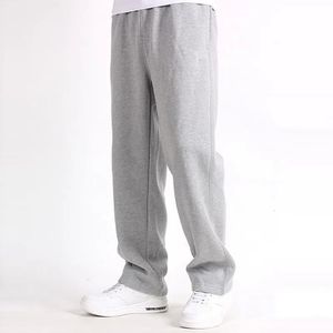 Calça de calça de tamanho grande da primavera calça elástica solta sólida calça de moletom de algodão casual calça reta de outono 240410