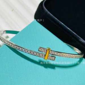 Hot Pickin High quality fashionable trend inlaid zircon dual color split electric cross bracelet