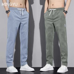 Męskie spodnie Mingyu marka bawełniana spółka spodni męskie szczotkowane elastyczne talii elastyczne zielone zielone szary czarny czarny jogging ubrania robocze MENSL2404