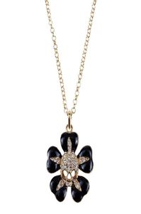 Black small flower inlaid with gold skull Saturn necklace Lacquered skull flower necklace1016036