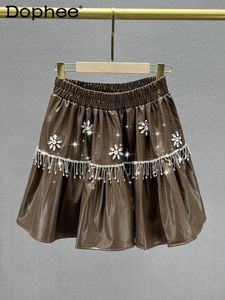 スカートファッションタッセルダイヤモンドレザースカート女性2024秋の冬のハイウエストアインラインビッグヘム女性弾性
