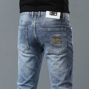 Mäns jeans designer Nya vattentvätt Jeans Herrens tunna vår/sommar smala fit modemärke små ben elastiska långa byxor