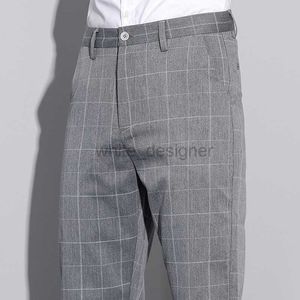 Projektant dżinsów na męskie wiosnę/lato nowe męskie szachownicze spodnie Business Business Men's Long Pants 156