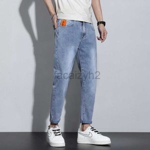 Jeans masculinos Primavera/verão Novo jeans masculino Elastic Youth Youth 9 polegadas Tubo reto de calças de tamanho grande de azul-azul