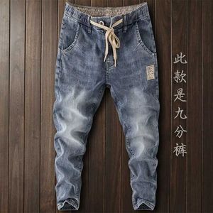 Mäns jeans lyxiga koreanska stilkläder män denim med elastisk midjeband dragsko för tvättad hösten avslappnad stretch man q240427