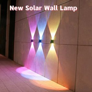 Dekorationer 2 LED Solar Wall Lamp Waterproof Outdoor Solar Garden Decor tänds och ner Lysande belysning för gatan Balcony Garden Villa